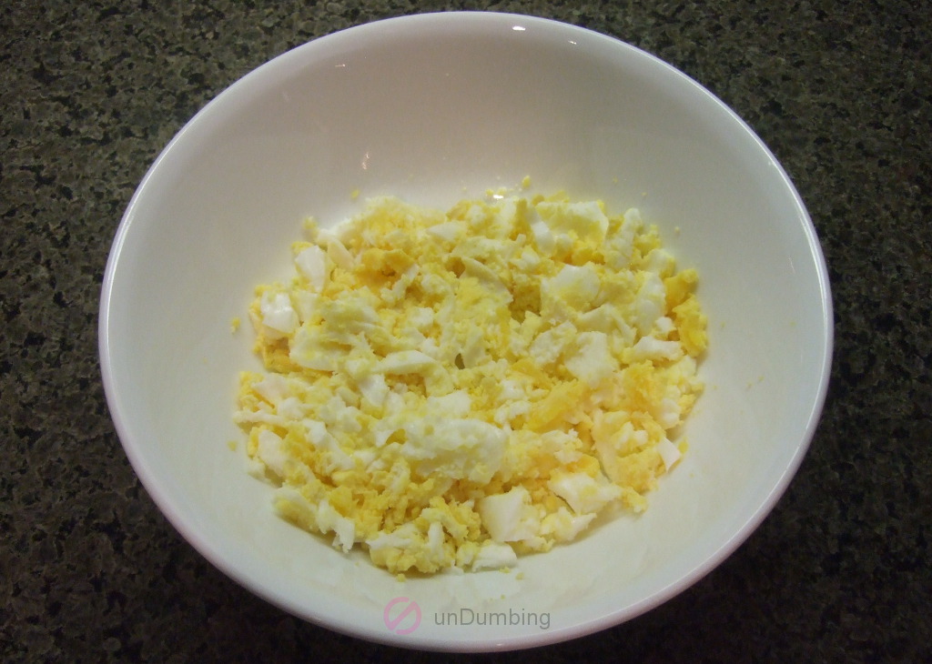 Mashed eggs in a white bowl