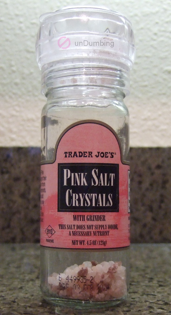 Bottle of pink salt crystals