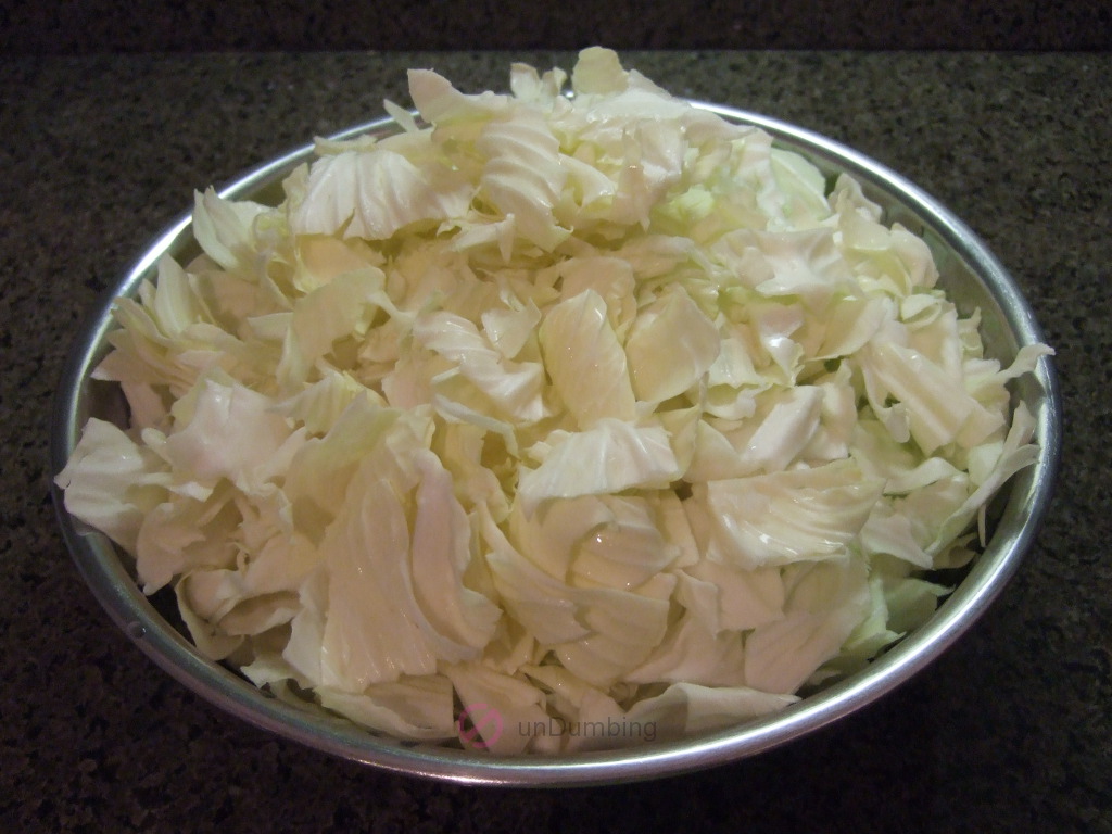 Cut-up Taiwanese cabbage in a stainless steel bowl