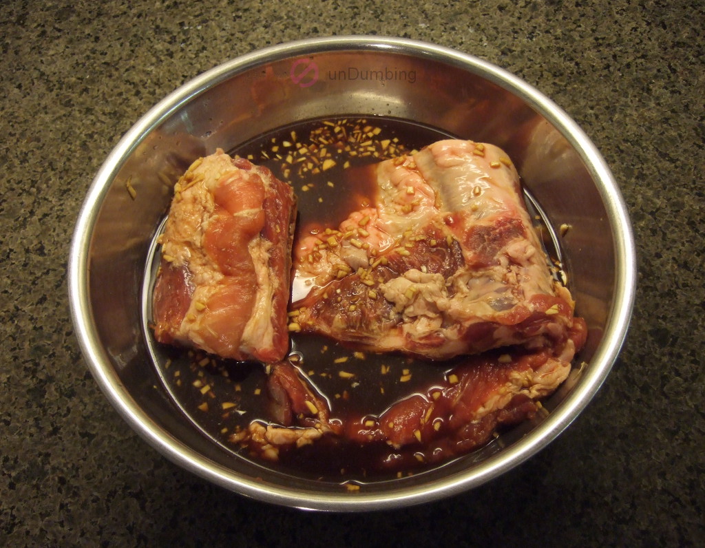 Marinating ribs in a stainless steel bowl