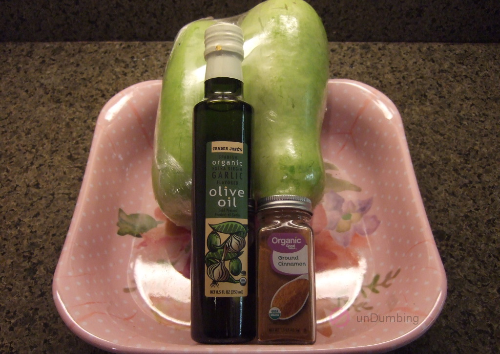 Opo squash, olive oil, and cinnamon in a pink plastic tray