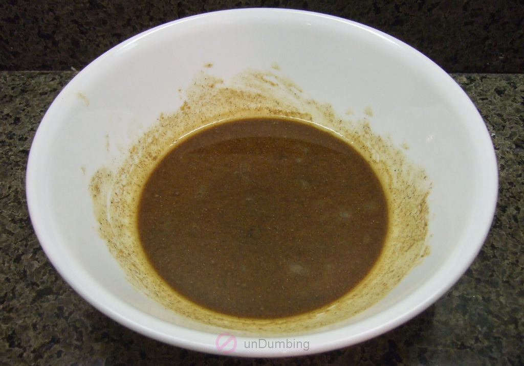 Beef marinade in a white bowl