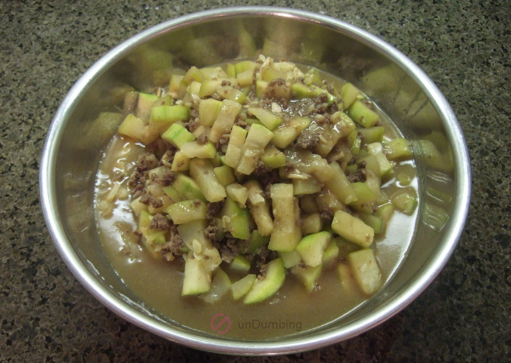 Fuzzy melon with ground beef in a stainless steel bowl