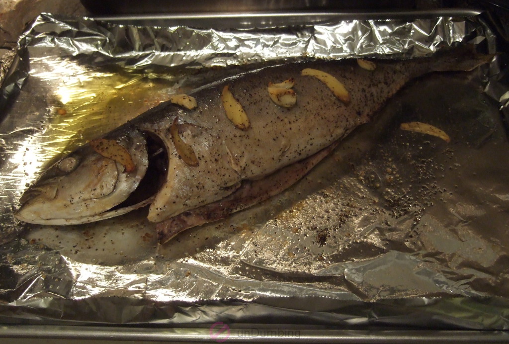 Baked yellowtail on foil-lined baking sheet