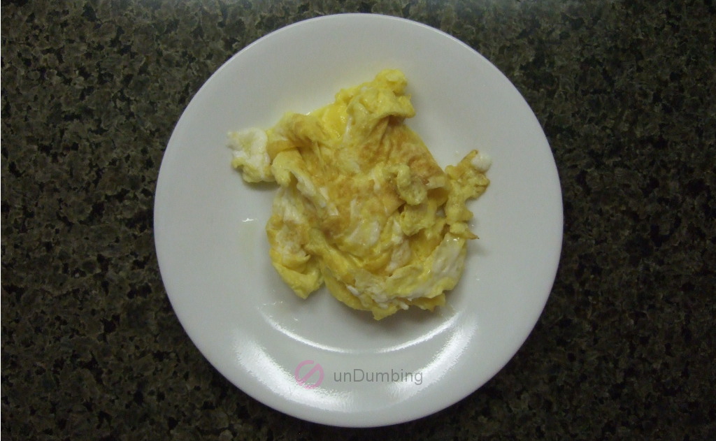Scrambled eggs on a white plate