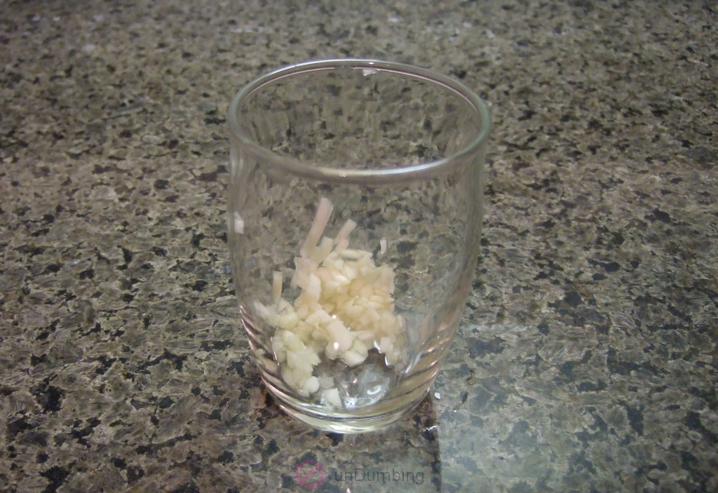 Minced garlic in a small glass