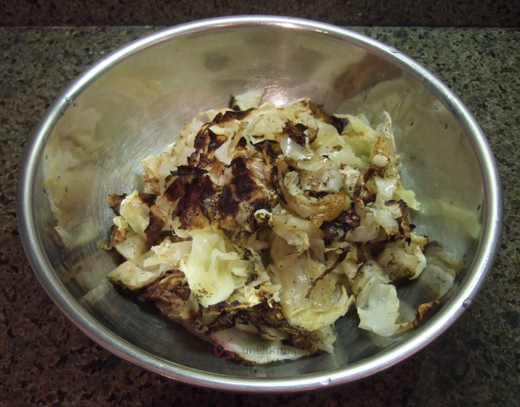 Roasted cabbage in a stainless steel bowl