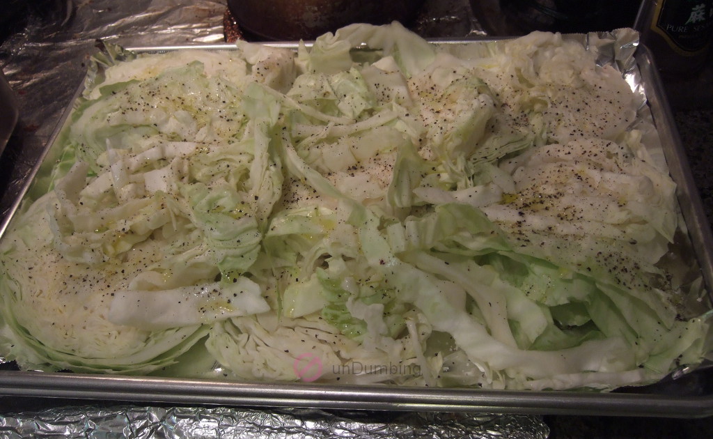 Cabbage slices with seasoning on a foil-lined baking sheet (Try 2)