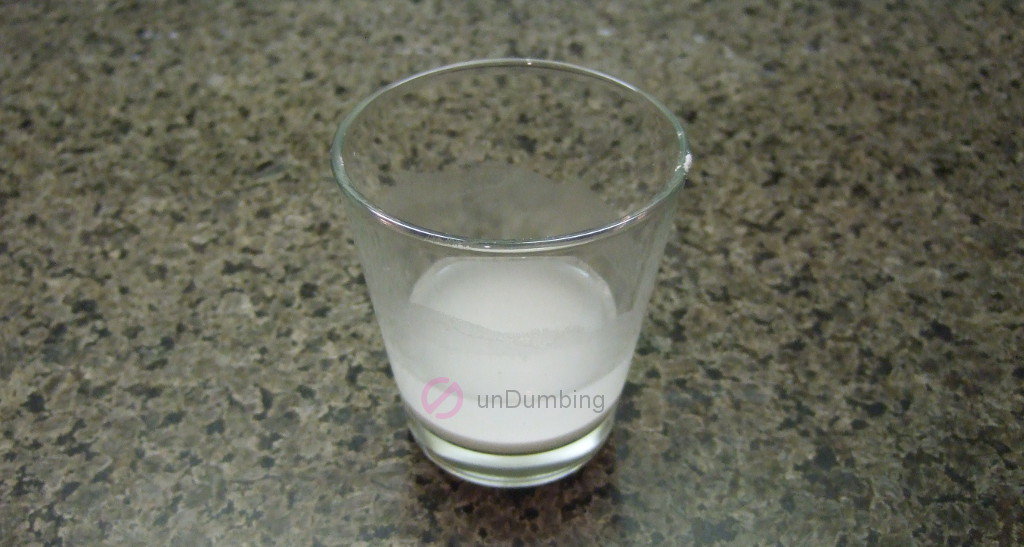 Corn starch mixed with water in a shot glass