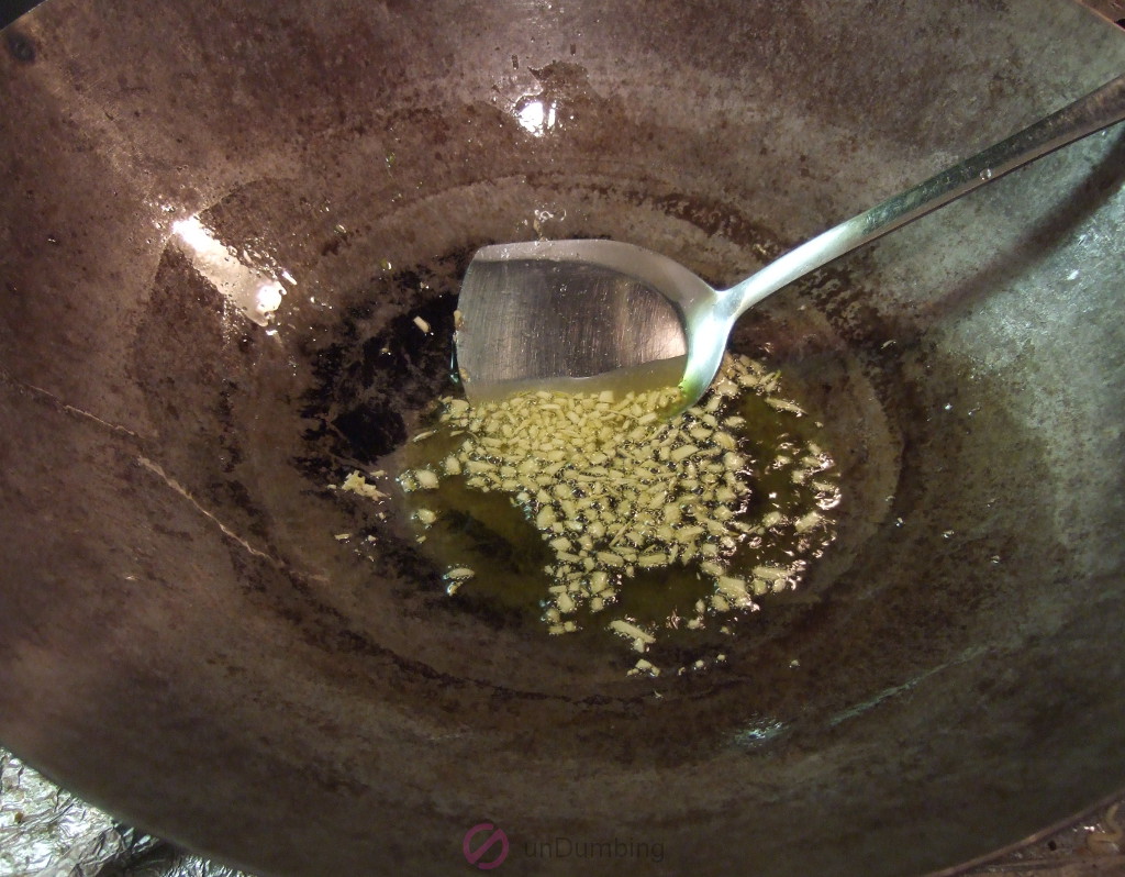 Garlic browning in a wok