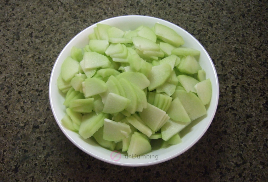 Sliced chayote squash in a white bowl