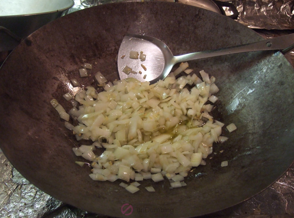Onions softening in a wok