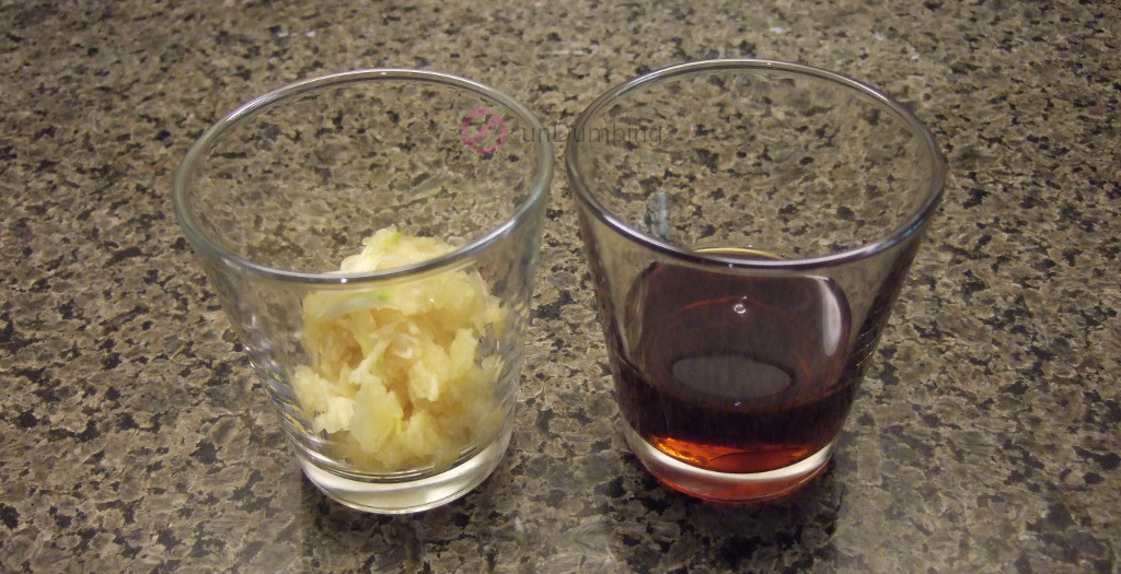 Grated garlic and sesame oil in shot glasses
