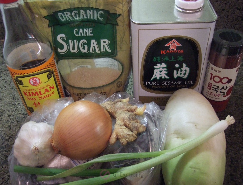 Soy sauce, sugar, sesame oil, gochugaru (Korean crushed red pepper), garlic, onion, ginger, mackerel, green onion, and Korean radish