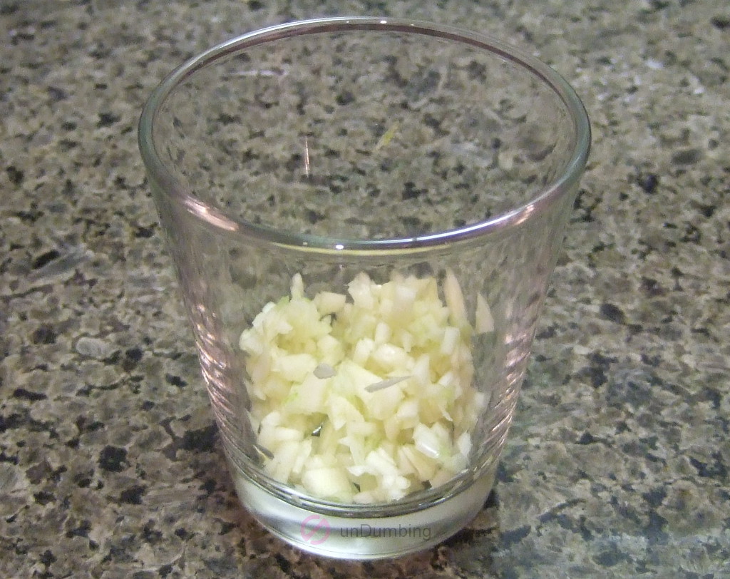 Minced garlic in a shot glass