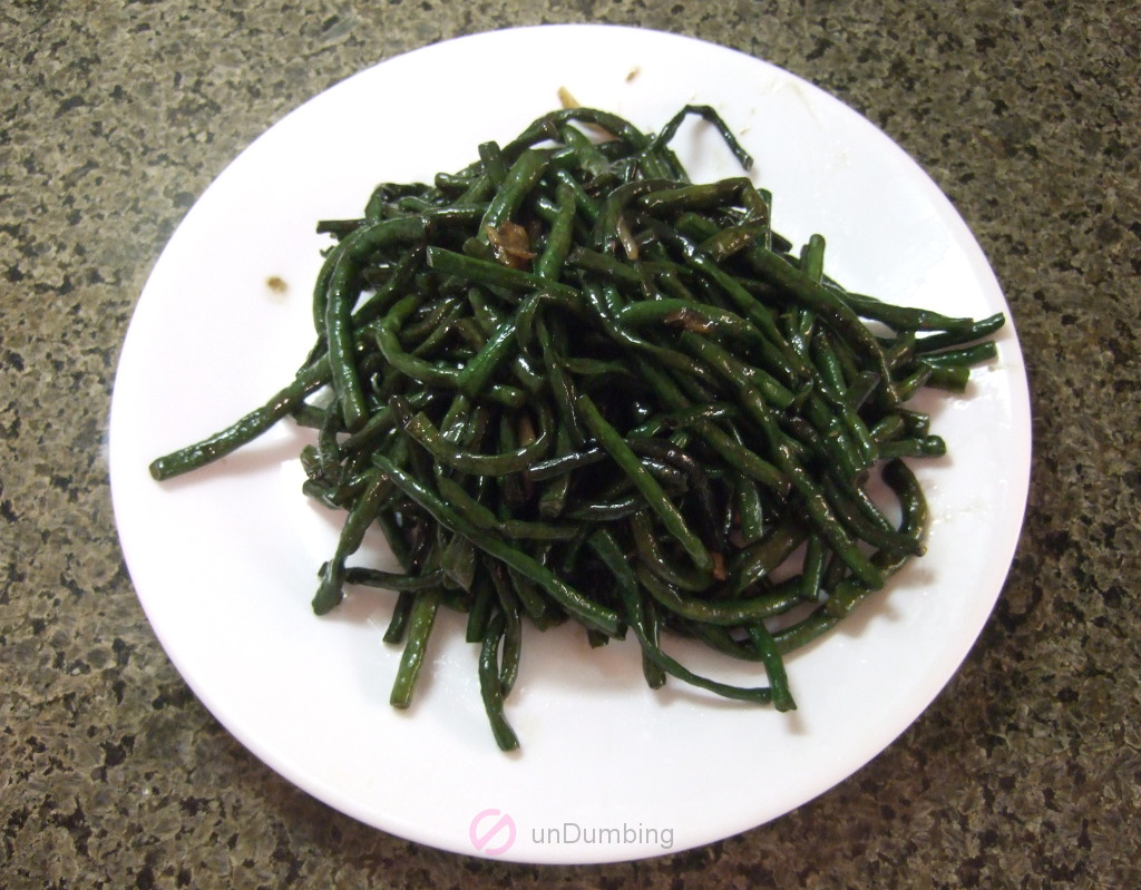 Stir-fried Chinese long beans on a white plate (Try 2)