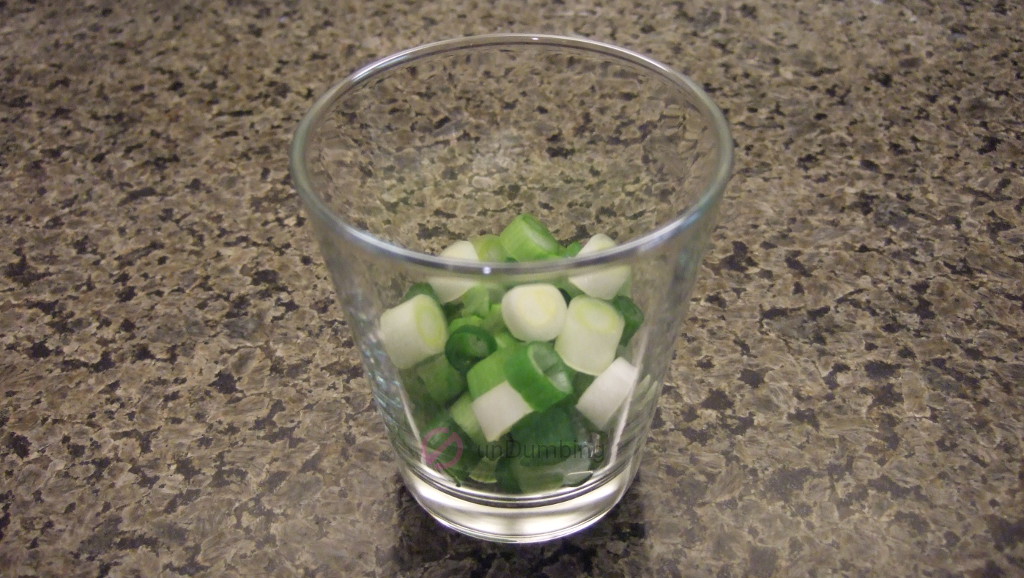 Chopped green onion in a shot glass