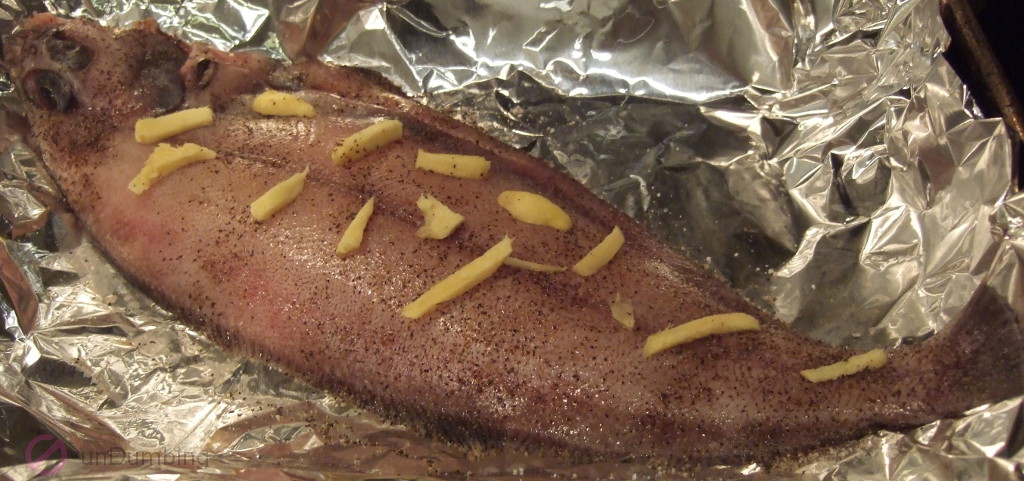 Fish topped with ginger on a foil-lined roasting pan (Try 2)