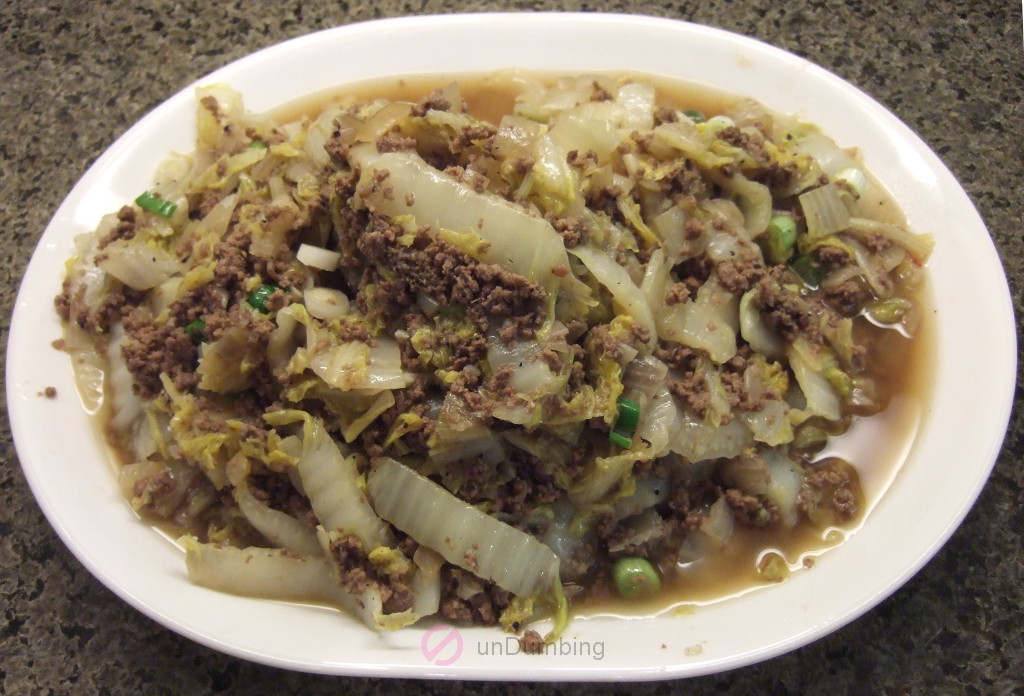Ground beef and Napa cabbage stir-fry on a white plate