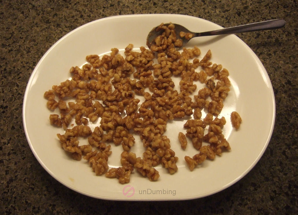 Candied walnuts on a white plate
