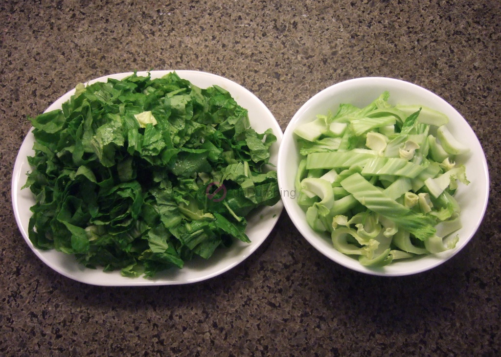 Chinese mustard greens separated in a white plate and white bowl
