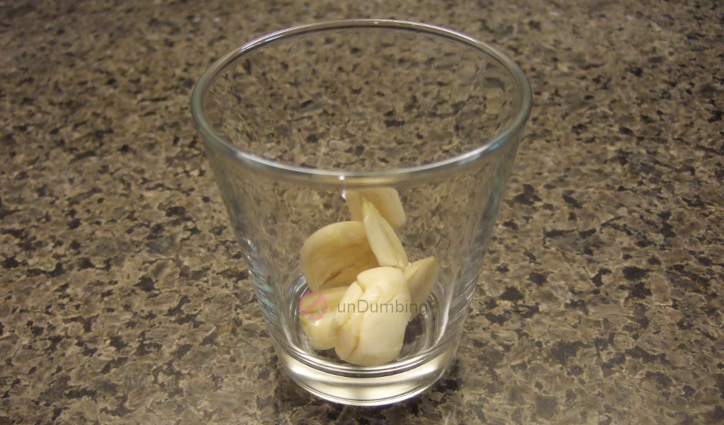 Smashed garlic in a shot glass