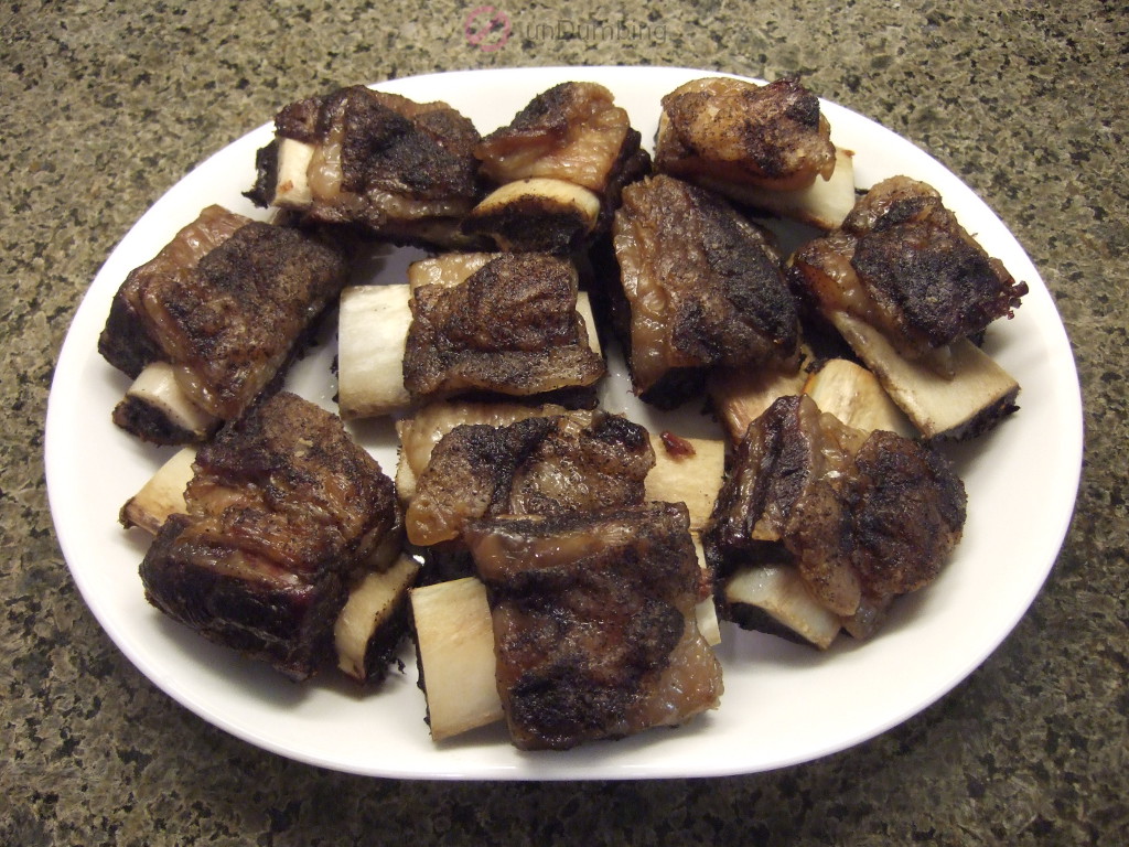 Roasted beef short ribs on a white plate