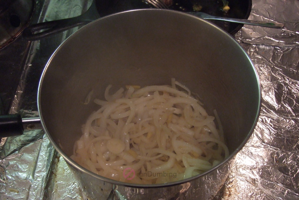Softened onion and ginger in a saucepan