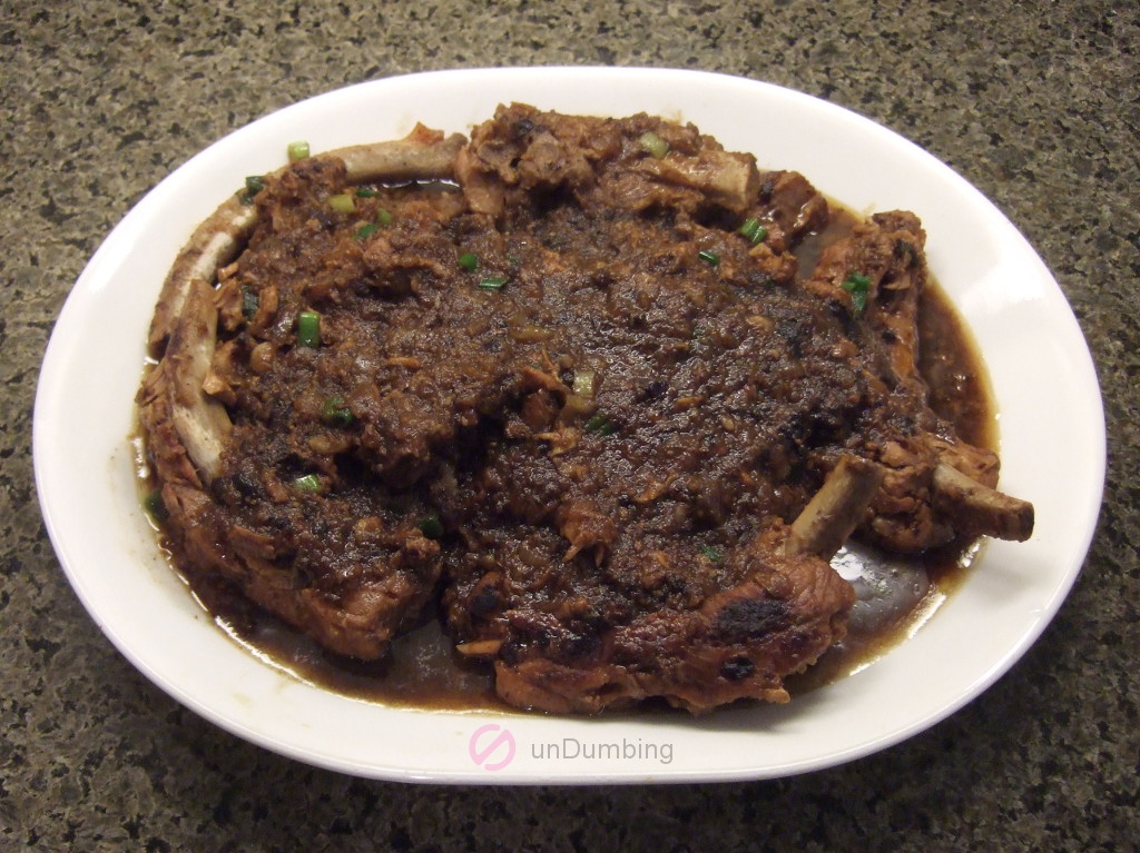 Braised ribs with black bean sauce on a white plate