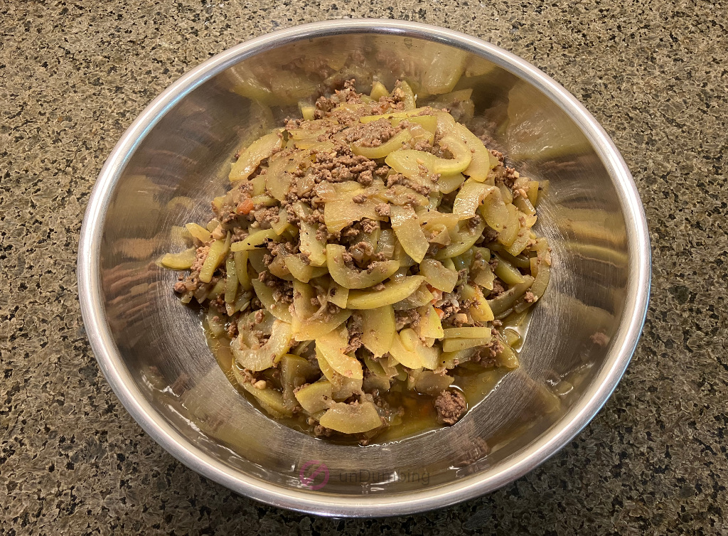 Sautéed Opo squash with ground beef in a stainless steel bowl (Try 2)