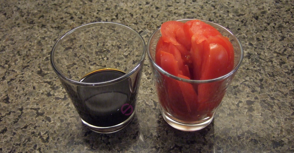 Sauce and sliced tomato in shot glasses